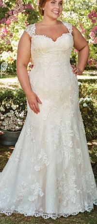 The Ultimate Guide to Wedding Gowns for Curvy Brides from Whitney of CurveGenius - Try the Brenda wedding dress by Rebecca Ingram with its fitted bodice and trumpet flare skirt.