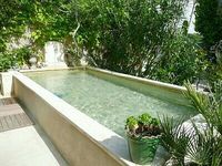 The old existing dam at his cottage to be replaced with a similar one in a new courtyard setup