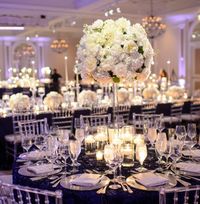 Photographer: Eli Turner Studios; Sophisticated white and navy blue ballroom wedding reception;