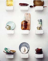 I love this display of objects on tiny shelves--where could I do this where everything wouldn't get knocked off while people pass by…?