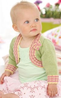 Free Knitting Pattern for Snuggly Baby and Child Bolero - Ribbed border with optional color stripes, attached knitted flower. Sizes Birth – 7 years (chest 16-26″/41-66cm). Designed by Sirdar.