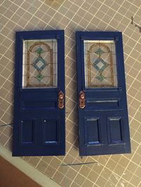Making doors I drew my design on mat board. I used left over picture mats. I cut the inside bevel out and put it on the doo...