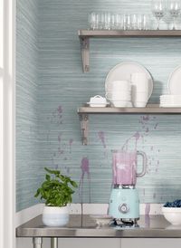Scrubbable, seamless, and created for high-traffic areas. Normandy, from Texture Resource 8, is a performance vinyl that emulates a horizontal raffia in its natural state which takes dye imperfectly, providing alternating shades of dark and light hues. #kitchendesign #modernwallpaper #homeinspiration