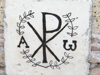 Chrisme avec Alpha et Omega (A and W), the two letters that signify the beginning and the end (the first and last). The X and P (Chi and Rho) stand for the first letters of Christ's name (Christos).