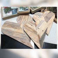 Aged pallet wood hearts forms before backs and framing.