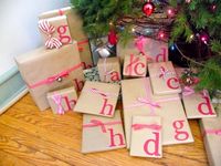 What a fun wrapping idea, take the first initial of whomever the present is for and wrap all of theirs with it.