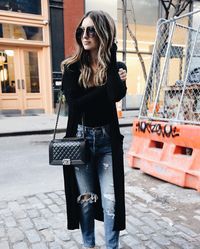 Ripped jeans, long black cardigan and Chanel boy bag