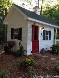 A 35 year career 2nd grade teacher, Barb Kingery from Illinois designed her dream potting shed herself. The potting shed design is an adaptation of plans that were in the 2005 July/August Handyman magazine. Barb purchased the red door at an antique store, and the builder turned it into a Dutch door as well as building the carriage doors. Every item including the brass and crystal chandelier was bought at garage and yard sales driving out in the country hunting for gardening themed items. The int