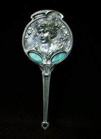 Art nouveau ladies’ hand mirror designed by Georges de Fuere, silver, enamel and glass, circa 1900.De Fuere (1868-1943) is most well known for his theatre designs and posters for Le Chat Noir Cabaret in Montmartre. For his...