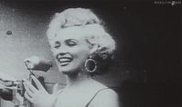 .gif Marilyn Monroe blows a kiss to the troops in Korea, 1954.