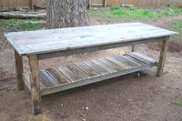 2 dollar farmhouse table made from pallets. I can see this for the buffet outdoors.
