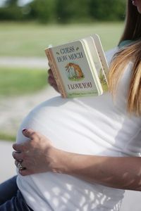 I love the idea of taking maternity shot pictures with books - especially since that's my most requested item for baby: books!