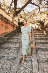 Next-level sophistication. Chic removable belt adjusts to cinch waist as desired for the most flattering fit. Ophelia features opalescent buttons, hip pockets, two slits, and lining - ending a few inches above the knee. 100% breathable embroidered cotton. Designed, dyed, and sewn in Los Angeles.