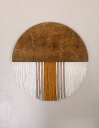 "PLEASE ADD COLORS OF STAIN AND YARN INTO THE NOTES AT CHECKOUT 36\" Wood & Fiber Cicle Art Wall Hanging Each circle is crafted with 1/2 inch maple wood and stained with the stain of your choice! Each piece of wood has a different grain, making each piece unique✨ For the fringe we use 100% low pill acrylic yarn, for EVERY piece (same as pictured). With our large variety of colors, we allow each customer to customize their piece to fit their individual personalities! 🐝 The yarn is hand-cut a
