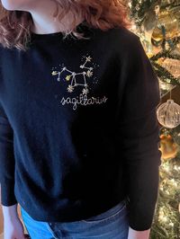 What's your sign? Our new zodiac collection of sweaters are made from 100% sustainable cashmere and then hand-stitched and hand beaded in NYC. All Lingua Franca pieces are hand embroidered once your order is placed. Please allow about 2-to-3 weeks for embroidery, plus shipping time (1-5 days). Don't see your size? Want it in another color? Build a custom sweater here! (Please select shadow beading if you would like the same tonal beading pictured here). Because all items are hand-embroidered t