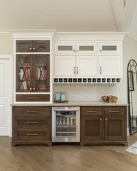This was the homeowners’ third custom home so they had a strong vision from the beginning of what they wanted. The house is surrounded by trees close to the water so the clients requested a "cozy cottage" feel that still appeared polished and provided functionality for everyday living and entertaining.