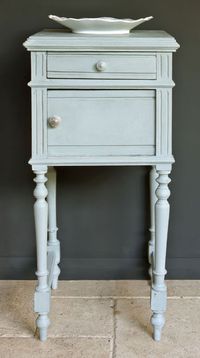 A side table painted in Duck Egg Blue against a Grahite wall for stylish French elegance