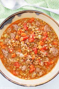 Warm up on a cold day with hearty sausage lentil soup. Enjoy rich flavor with tomatoes and Italian spices. Get the easy copycat recipe and find out how to make the best sausage and lentil soup. #souprecipeseasy #souprecipe #italianfood #copycat #copycatrecipes #lentils #lentilsoup