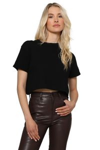 This top features a crew neckline, short sleeves, cropped fit, and a relaxed silhouette. Rowena is 5'8" and is wearing one size fits most 100% Cotton Machine wash cold gentle cycle Tumble dry low Hang or line dry