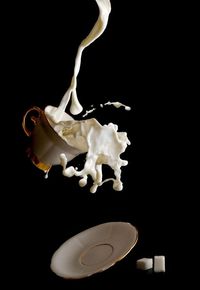 This also is an obvious image of a movement because this cup of milk is falling and the milk is spilling everywhere.