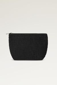 The Lola Terry Cosmetic Bag features a super soft terry material, a colorful geometric pattern throughout, a medium-sized pouch, and a zipper to close! Medium-sized Cosmetic Bag Green, Black, Pink, Orange, and Blue Zipper to close