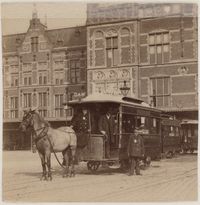Main entrance Central Station Amsterdam. In the foreground: a horse tram of the Amsterdam Omnibus Maatschappij (AOM), established on 1 July 1872 and taken over by the municipality of Amsterdam on 1 January 1900. Approx 1889 - 1904