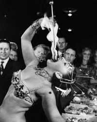 Yasmin Trevanna gives a preview of her fire-eating act at the Magic Circle headquarters in London on Oct. 9, 1961.