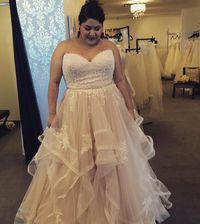 This strapless plus size wedding dress has a lace empire waist bodice. The a-line skirt features a textured hem. Curvy brides can have plus size wedding dresses like this customized to their personal taste & style. We are US dressmakers who specialize in totally custom wedding gowns & #replicas of designer dresses too. Contact us for details at www.dariuscordell.com
