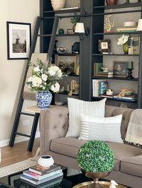 Living room Spring decor. Home decor ideas, home library, library ladder. Follow my shop @ellenblisshome on the @shop.LTK app to shop this post and get my exclusive app-only content! #liketkit #LTKhome #LTKSeasonal #LTKstyletip @shop.ltk https://liketk.it/41ffR