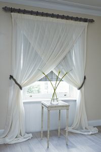Crossover sheer curtains -> Love this look! ... Did this but not quite as far crossed over only mb a foot. Looks great and having the curtain so close to the ceiling really makes the ceiling look higher