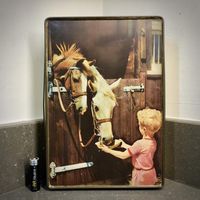Large vintage EDWARD SHARPE biscuit tin. Boy Feeding horses in a stable.Nice sized tin, so many uses. The sides are gold coloured with a few marks. The lid has a photograph with a matte finish, set very flat inside a slightly raised lip. A little boy in red summer shorts and striped t’ shirt holds a bowl up to feed two horses.The colours are good. A few minor scratches as to be expected from an old tin. There is bowing to the opening edge of the tin. It’s impossible to open with out it! The tin