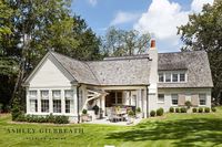 ASHLEY GILBREATH INTERIOR DESIGN: A Southern backyard perfect for entertaining with lots of green space for the kids, covered grilling kitchen with The Big Green Egg, outdoor dining space, and a covered lounge area with lots of seating and wood burning fireplace perfect for roasting marshmallows.