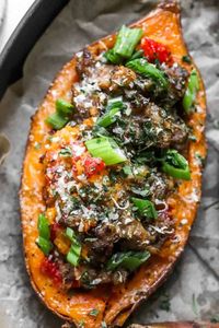 Savory twice baked sweet potatoes are made with roasted sweet potatoes, cooked sausage, roasted bell pepper, onions and garlic. They make one of the best main or side dish recipes that is family-friendly, gluten free, and paleo-friendly.
