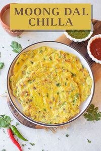 Moong Dal Chilla is a delicious protein-packed Indian breakfast made with yellow moong dal along with simple spices and herbs, including chilies and onions. These savory lentil pancakes are nutritious, vegan and gluten-free. | Moong dal chilla recipe | easy Indian | https://pipingpotcurry.com/moong-dal-chilla/