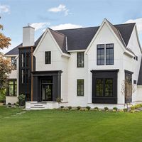 James Hardie Building Products on Instagram: “This beautiful modern Tudor by @SD_customhomes features HardiePanel vertical siding alongside matching painted brick to form the base of a…”