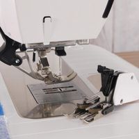 Walking Foot #50 and the Dual Feed available on some BERNINA models both have similar functions – moving the top fabric while the bottom fabric is moved by the feed dog. This helps control shifting and moving of the layers of fabric and/or batting. Even though they have comparable purposes, the way they accomplish their goals is different and gives slightly different results. #sewing #quilting #tips #tricks #techniques