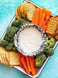 Say goodbye to curds because this Garlic Herb Cottage Cheese Dip is whipped until smooth and creamy for a high protein vegetable and chip dip! BudgetBytes.com