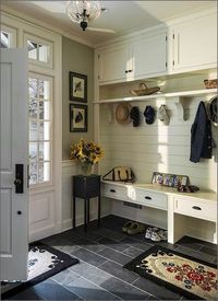 Now this is an entryway to be jealous of! I love how simple, minimalist, & clean it looks. The vase of sunflowers really brightens the area up too!