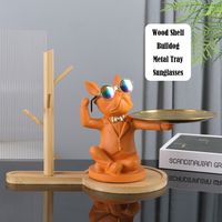 Product Description * Fashion sunglasses dog statue decoration * Wood shelf / Sunglasses / Dog statue / Metal tray * Multifunction table ornaments / Shelf / Key hook / Fruit dish / Candy tray / Keys tray / Jewelry tray * Resin material * 4 Colors * Living room / Bedroom / Kids Room / Store / Hotel / Table Ornaments * Size as same as photos display * Tray diameter 17cm * Smooth Surface * Suitable for home decoration or party decoration or festival decoration