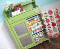 a pie safe filled with quilts