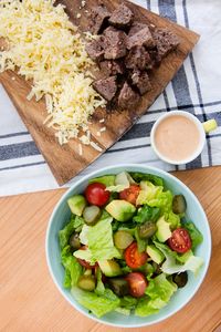 This salad has everything I love about a cheeseburger, sans the bun. Chopped romaine, tomatoes, avocado, pickles and shredded cheese are topped with grilled burgers and red onions and drizzled with a seriously delicious dressing.