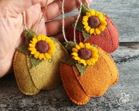 "Wool felt pumpkin ornaments for Fall decorations. Listing is for 1 ornament. Ornaments are made from pure wool felt and wool blend felt. Size of ornament is about 7 x 8 cm ( 2 7/8 \" x 3 1/8 \") Pumpkin ornaments can be made in other color combinations. Please message me for options. Color options for pumpkin ornament: - Honey yellow-green ( with heathered structure ) - Spice orange brown ( with heathered structure ) - Rusty Ember ( orange red brown with heathered structure ) - Mottled red ( ri