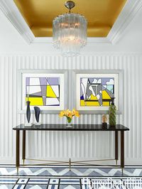 Donghia's silver-leaf tea paper to add a warm glow to the foyer.