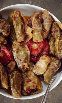 In Armenian and nearby Middle Eastern cuisines, dolma refers to a family of stuffed vegetable dishes, most often wrapped in grape or cabbage leaves. You can use this same meat-and-rice filling—and a similar steaming technique—to hollow out and stuff zucchini, eggplant, tomatoes, or peppers. Dolmas taste best warm, and leftovers can be resteamed one or more times as desired.