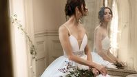 Anabella by #JustinAlexanderSignature A cutting edge style with a deep, plunging neckline with beautiful and hand beaded waistband. Couture knife pleats accent the mikado natural waist and added pockets highlight this stunning ball gown #weddingdress. Ivory/Silver/Nude