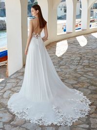 Romantic A-line wedding dress with lace illusion bodice, chiffon skirt, dramatic lace train and V neckline. #MissRubyBride