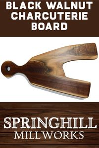 Beautiful Black Walnut charcuterie board with handle, finished in a food grade oil & beeswax mixture to give it a beautiful sheen. This attractive charcuterie board is finished on both sides, making it the perfect cutting board to use on either side. Size: 25.5 in. x 12.5 in. x 1.25 in. (approximately)
