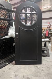 This Iron door as a copy of our mahogany porthole door. Since iron is painted it will provide less mantenence than wood.