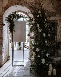 Wedding & Events Floral Design on Instagram: "Boiler Bar Styling for Layla & Michael 🖤 . Foam Free Half Arch & Seating Plan Frame with Design . Image @georginaharrisonphoto Florals & Styling @weddingandeventsfd Venue @middletonlodge Bride @laylapriddy . #middletonlodgewedding #middletonlodge #foamfree #styling #ceremony #roses #candles #Arch #weddingarch #thelane #italianstyle #italianwedding #ibizawedding #ibizastyle #weddingstylemaguk #weddingideas #weddinginspiration #eventflorist #event