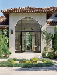 Love the doors within the large, arched windows.  Gorgeous design.